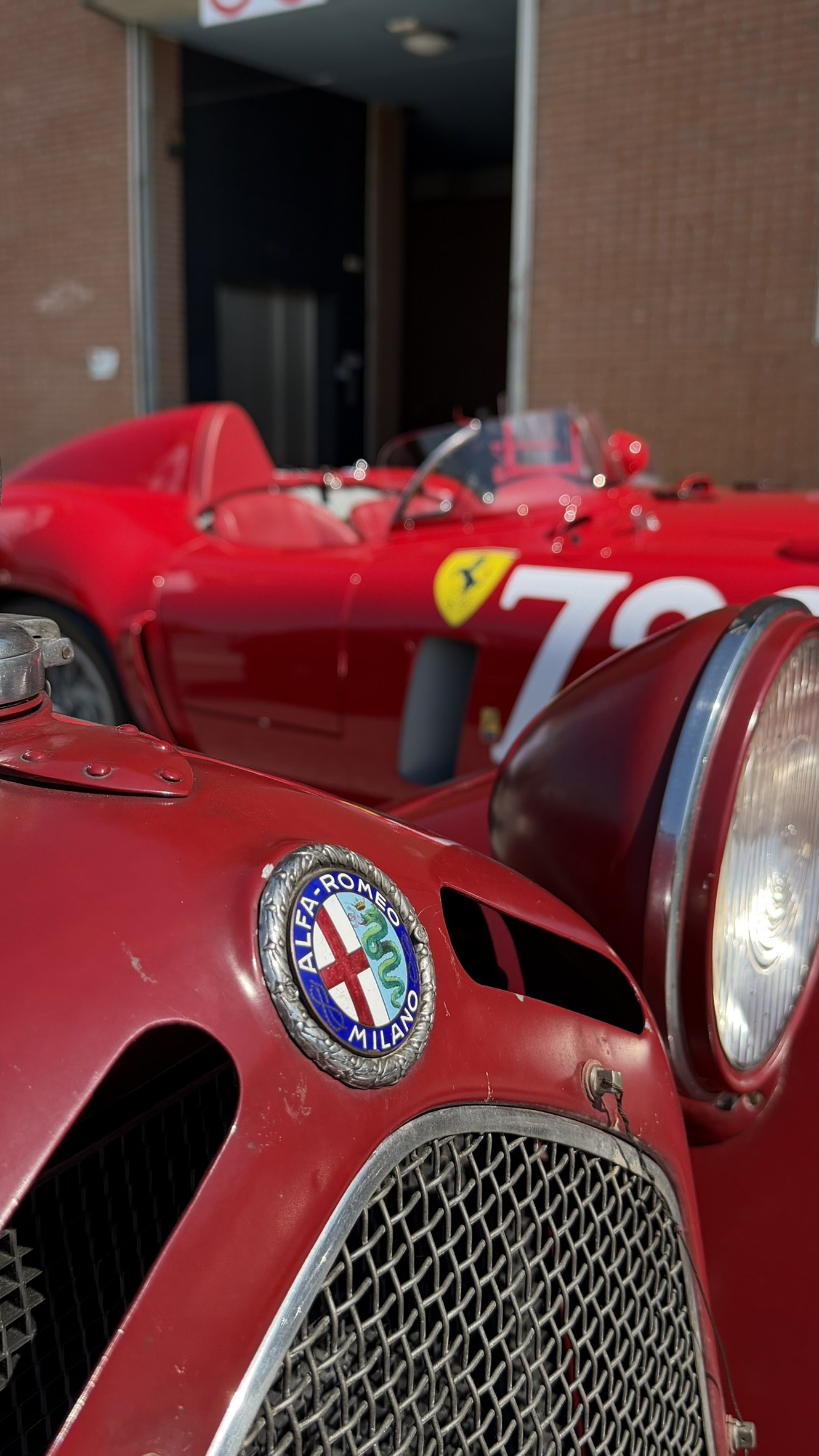 Alfa Romeo Milano badge and headlamp detail